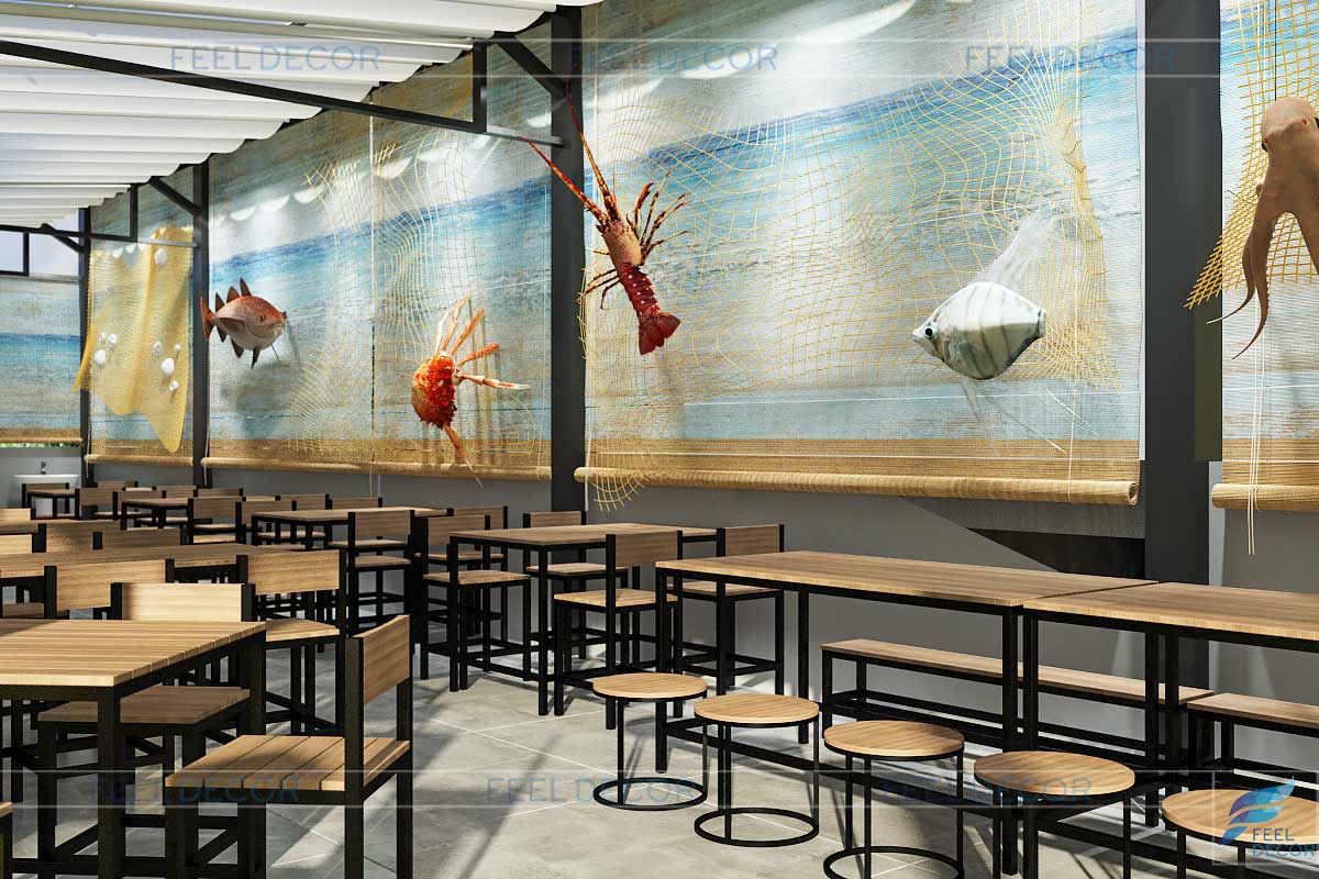 Các chi tiết trang trí như lưới, mô hình cá, tôm thể hiện chủ đề chính của nhà hàng.